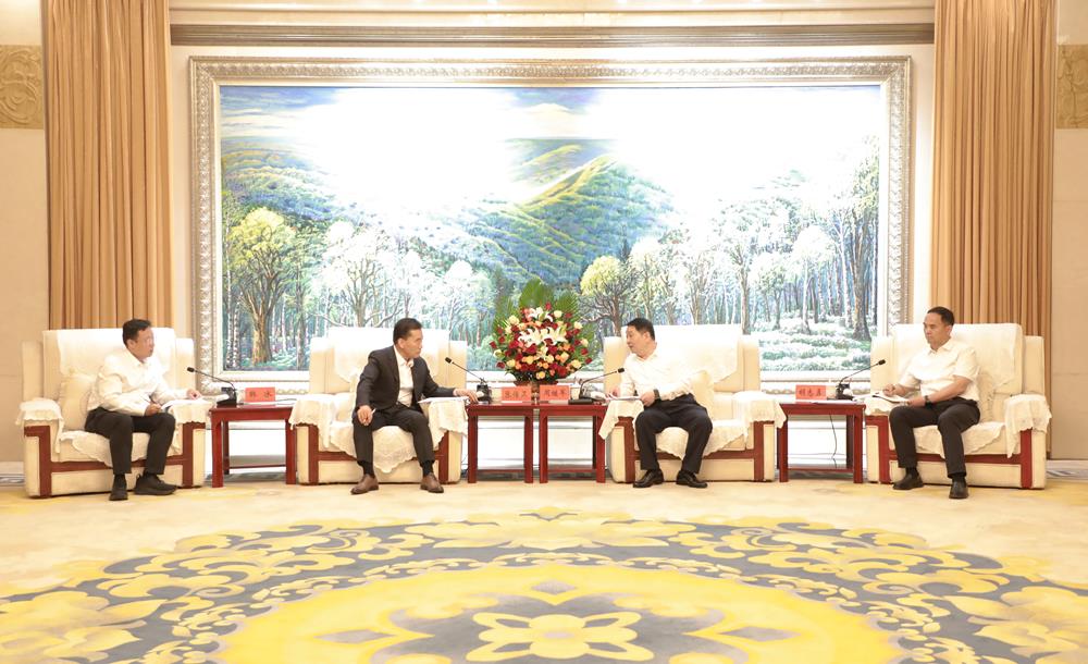 周继军胡志勇与明阳智慧能源集团股份公司董事长张传卫座谈